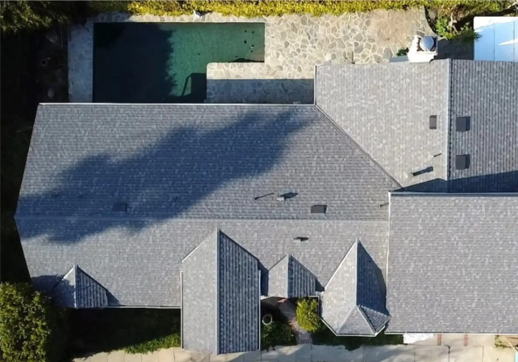Gambit Roofing professional performing roof inspection